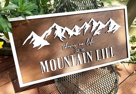 "A beautiful home decor piece makes a perfect addition to any mountain lover's house! This stunning sign is made from laser-cut birch wood and completed with your choice of stain color. Available in several different sizes, this sign is great as an accent or centerpiece! (LENGTH x HEIGHT) 24\" x 12\" 28\" x 14\" (shown) 32\" x 16\" 36\" x 18\" Includes hanging hooks on the back of the sign so you can attach it to a wall. ----:| TURNAROUND AND SHIPPING |:---- We allow a minimum of twenty-four hou Lodge Signs Diy Rustic Wood, Mountain Welcome Sign, Wood Burned Mountains, Mountain Decorating Ideas, Cricut Wood Sign, Mountain Chic Decor, Mountain Airbnb, Mountain Lodge Decor, Laser Cut Wall Decor