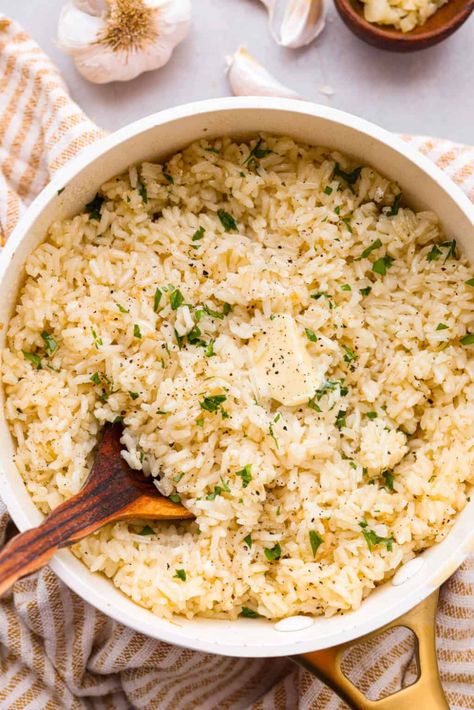 Garlic Butter Rice is the perfect side dish for dinner! A simple mix of butter, sautéed onion, garlic, and chicken broth gives this rice tons of great flavor. It's easy to make and tastes amazing! Buttered Rice Recipe, Stick Of Butter Rice, Garlic Butter Rice, Side Dish For Dinner, Buttery Rice, White Rice Recipes, Garlic Rice, Easy Rice Recipes, Butter Rice