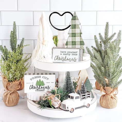 Simplify your holiday decorating with our deluxe farmhouse Christmas decor set! Each piece is perfectly coordinated and sized to fit your tiered tray, shelf, or any small vignette. Say goodbye to the frustration of mismatched decor and enjoy a beautifully styled space with ease. NOTE: The tiered tray and other items shown are for display purposes only and are NOT included in the decor set. Everything included is listed below. Sizes are approximate. Colors variations and styles may vary. The Merr 3 Tier Christmas Tray, Christmas Vignettes Farmhouse, Console Table Decorating For Christmas, Christmas Decorative Tray, Green Farmhouse Christmas Decor, Christmas Tier Tray Ideas, 2 Tier Christmas Tray Decor, Two Tier Tray Decor Christmas, Tiered Tray Christmas Decor