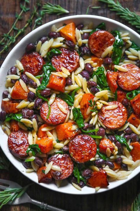 Butternut Squash and Black Bean Orzo with Sausage and Spinach in a white bowl. Dinner Recipes With Broccoli, Orzo With Sausage, Recipes With Broccoli, Roasted Butternut Squash Cubes, Butternut Squash Black Bean, Simple Spinach Salad, Sausage And Spinach, How To Cook Orzo, Butternut Squash Recipes