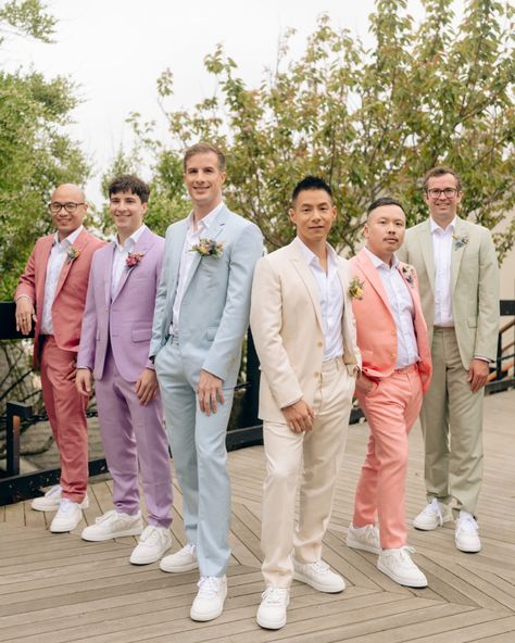 Captured the stylish vibes of Jeff and Ben’s spring wedding at the @gurneysresorts with their dapper groomsmen in colourful pastel suits. Photographer: @khatleen.photography Videographer: @bradyweddings @thebrothersgorman @angelo.rigogliosi Florist: @jennywildflower Makeup: @mariaortegamakeup Grooms’ Suits: @dior Groomsmen Suits: @indochino @indochinoweddings Pastel, Pink Groomsman Suit, Grooms Man Suits Wedding Ideas, Garden Party Suit Men, Pastel Suit Men Wedding, Multicolor Groomsmen Attire, Groomsmen Multicolor, Groom In Blue Suit, Groomsmen Attire Pastel Colors