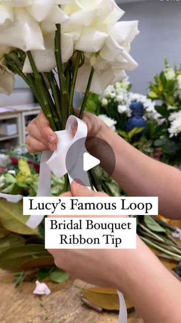 SYDNEY FLORIST • SYDNEY FLOWER DELIVERY • FIVE GENERATIONS 💐 on Instagram: "TIP FOR FLORISTS ✨💫 Watch for a super simple way to ribbon your next bridal bouquet. Using this loop technique means you have no bulky knot when you tie it off. It looks so neat wrapped around the stems.

😆 Disclaimer:  I put Lucy on the spot for the name of this! There may be lots of you using this technique, she’s just famous in our store amongst our florists because we hadn’t seen it before and she’s taught everyone!

😊 Any questions just ask x

#floristtip #floristhack #bouquetribbon #weddingflorist #weddingtip #flowersofspring #sydneyweddings #whiteroses #ribbon" How To Make A Simple Bridal Bouquet, Wrapping Ribbon Around Bouquet, Bridal Bouquet Ribbon Wrap, Diy Hand Tied Bouquet, How To Tie Bouquet With Ribbon, Dance Bouquet Ideas, How To Wrap Ribbon Around Bouquet, How To Tie Ribbon On Bouquet, Bridal Flowers Bouquet Simple