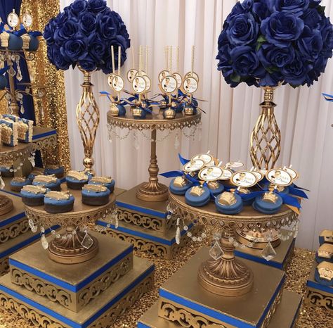 Blue And Gold Chambelanes, Navy Flower Centerpieces, Dark Blue And Gold Decorations Party, Quince Table Centerpieces Blue, Blue And Gold Western Theme, Royal Blue And Gold Quinceanera Centerpieces, Royal Blue And Gold Dessert Table, Quince Court Table Blue, Quinceanera Dresses Royal Blue And Gold