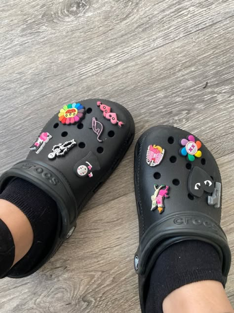 black, pink & rainbow Black Crocs With Pink Charms, Black Croc Outfits, White Crocs Jibbitz Ideas, Black Crocs Aesthetic, Black Crocs With Charms, Jibbitz Crocs Ideas, Rainbow Crocs, Croc Jibbitz Ideas, Aesthetic Crocs