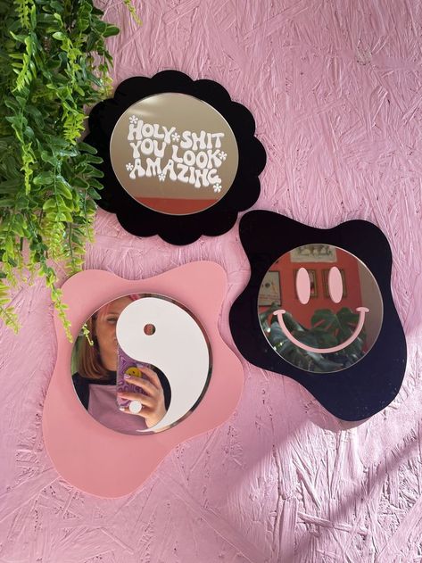 Pink wall with collection of Printed Weird groovy shaped mirror backs, available in lots of colours Diy Funky Mirror Frame, Small Round Mirror Decor Ideas, Aesthetic Mirror Diy, Mirror Ideas Aesthetic, Groovy Mirror, Funky Mirror Ideas, Disc Mirror, Mirror Painting Ideas, Blob Mirror