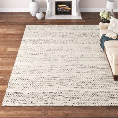 This area rug is a versatile addition to almost any room in your home. It has a medium pile height and no backing that make it flexible, a cinch to clean, and easy to slip under any door. Plus, it features a two-tone black and cream design that blends in with any colour palette and gives it a striped look. We recommend spot cleaning this rug, and shaking it out when it needs a clean. Hand-curated by Kelly Clarkson. | Kelly Clarkson Home Sylvie Chevron Handmade Flatweave Wool Cream/Black Area Rug What Size Rug For King Bed, Rugs For Dining Room Table, Bedroom Rugs Under Bed, Beige Couch, Linen Couch, Cream Design, Neutral Area Rugs, Kelly Clarkson Home, White Dining Table