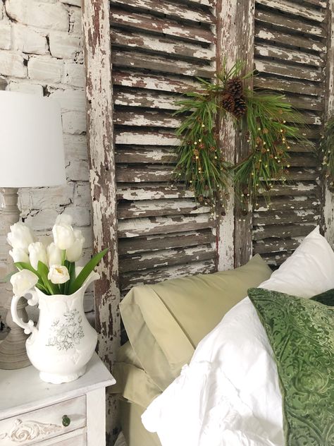 How we made our antique shutter headboard and decorated it, too! Headboard Made From Old Windows, Louvered Door Ideas Repurposed, Window Headboard Ideas, Shutter Headboard Ideas, Old Window Headboard, Old Shutters Decor, Shutter Headboard, Shutters Bedroom, Cabin Bedrooms