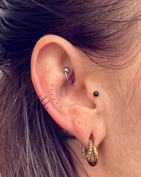 Hand poked dots and lines tattoo located on the ear. Dots On Ear Tattoo, Dainty Ear Tattoos For Women, Tiny Dot Tattoos, Ear Dot Tattoo, Outer Ear Tattoo, Ear Tattoo Dots, Ear Tattoo Inner Simple, Line Ear Tattoo, Small Ear Tattoos