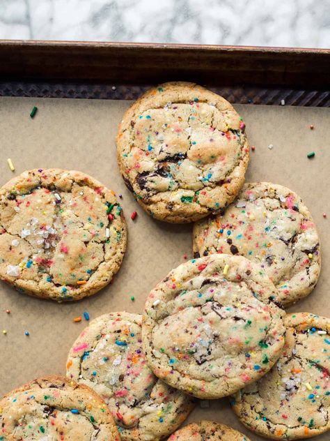 Sprinkle Chocolate Chip Cookies by Wood and Spoon blog. These are chocolate chip cookies with added color and sweetness from rainbow sprinkles. Combined, the chocolate and nonpareils made a textured and flavorful chocolate chip cookie that is festive and fun to make. These simple cookies are easy to make and delicious for the whole family. Find the recipe on thewoodandspoon.com Freezer Cookie Dough, Soft Frosted Sugar Cookies, Mini Cinnamon Rolls, Peppermint Ice Cream, Apple Bundt Cake, Funfetti Cookies, Cookie Dough Recipes, Sugar Cookie Frosting, Sprinkle Cookies