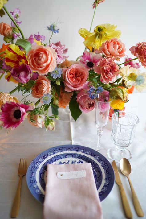 Spring Floral Tablescapes, Colorful Floral Tablescape, Bright Spring Floral Wedding, Bright Floral Wedding Decor, Blue And White China Wedding, Light Blue And Citrus Wedding, Blue China Wedding, Tablescape Flowers, Yellow Pink Blue Flower Arrangement