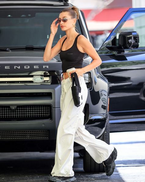 One thing about Mrs. Bieber... she's going to rock a sneaker. If you're looking for inspo this summer — from gorpcore styles to bloke trainers, see how the model has paired summer 2024's most versatile shoe trend with everyday looks. [Getty] Hailey Bieber Recent Outfits, Haylie Bieber Street Style, Hailey Bieber Outfits Summer, Hayley Bieber Street Style, Haylie Bieber Outfits, Hayley Bieber Style, Haley Bieber Street Style, Hayley Bieber Outfits, Hailey Bieber Summer