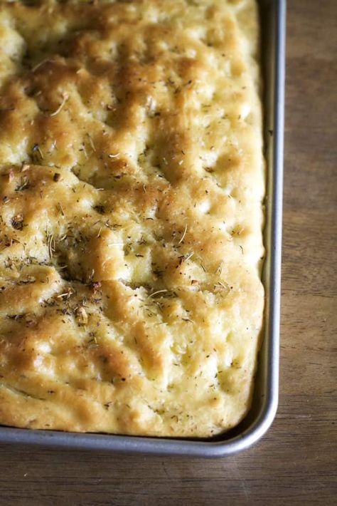 Warm, buttery bread made with olive oil infused rosemary, thyme and garlic. This garlic and rosemary focaccia will satisfy any craving for the rich Italian bread. | wanderzestblog.com #focaccia #italian #bread #baking #garlic White Bread Sandwich, Rosemary Focaccia Bread, Ciabatta Bread Recipe, Olive Oil Bread, Rosemary Focaccia, Rosemary Bread, Focaccia Bread Recipe, Italian Bakery, Rosemary Garlic