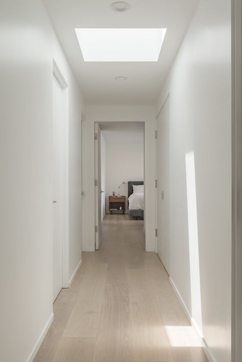 Hallway and Light Hardwood Floor A sky-lit hallway. Skylight Architecture, Manhattan Beach Homes, Style Californien, Manhattan Beach California, Skylight Design, Skylight Kitchen, Hardwood Floor Colors, Skylight Blinds, California Bungalow