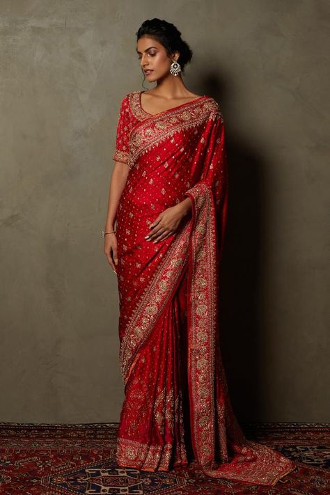 Red saree with floral zardozi embroidered motifs. Comes with unstitched blouse fabric. Components:2 Pattern:Embroidered,Printed Type of Work:Zardozi Fabric:Silk Satin Color:Red Other Details: Weight: 950 gms Saree Length: 5.5 Mtr. Approx Note: Stitched blouse worn by the model is not for sale Occasion:Wedding - Aza Fashions Red Saree Wedding, Red Sari, Saree Women, Indian Wedding Gowns, Bridal Sari, Red Bridal Dress, Traditional Blouse Designs, Floral Saree, Fancy Sarees Party Wear