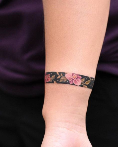 Bracelet Band Tattoo, Bands Tattoo For Women, Wrist Bracelet Tattoo Cover Up, Tattoo Bangle Wrist, Wrap Around Wrist Tattoos Cover Up, Orchid Tattoo Wrist, Arm Band Tattoo Women, Plumeria Band Tattoo, Arm Band Tattoo Colored