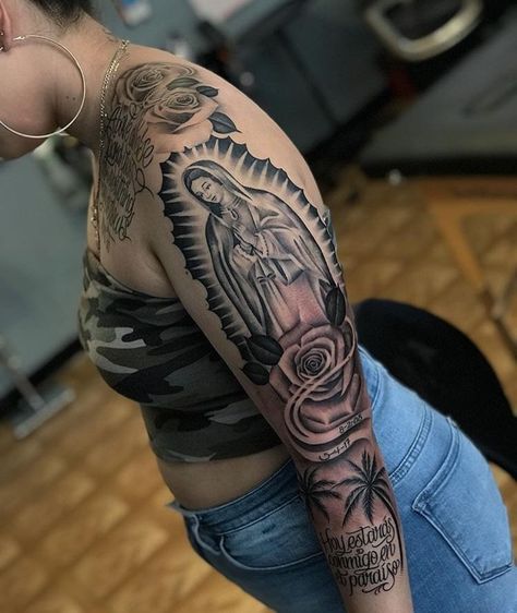 165+ Spectacular Virgin Mary Tattoos With Meaning (2022) - TattoosBoyGirl Virgin Mary Shoulder Tattoo, Chicana Tattoos For Women Sleeve, Full Shoulder Tattoos For Women, Virgen De Guadalupe Tattoo Ideas Women, Virgen Mary Tattoo For Women, Virgin Mary Tattoo For Women, Virgin De Guadalupe Tattoo Ideas, Hispanic Tattoos For Women, Thug Tattoos For Women