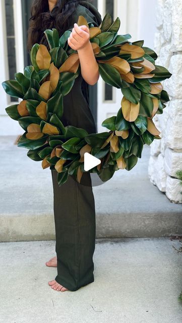 Jenny- Jenny’s Wreath Boutique on Instagram: "Make a magnolia wreath order with me!   I am complete obsessed with these artificial magnolia leaves. They make the most gorgeous and natural looking magnolia wreaths that are durable and will last for many years to come!   The wreath I’m making here is the 25” size of one of my magnolia wreath styles!   I actually have 3 different listings for my regular magnolia wreaths right now (and 2 different listing for fall magnolia wreaths). One that is all green with different magnolia leaves. One that is mostly green with the same leaves I’m using here. And this one that has more of the brown leaves facing forward.   Working on your wreath orders in my happy place, and I’m so thankful I get to do this for a living every day!" Wreath With Magnolia Leaves, Diy Magnolia Wreath Real Leaves, Magnolia Wreath Front Door Christmas, Magnolia Leaf Wreath Diy, Magnolia Leaf Christmas Wreath, How To Preserve Magnolia Leaves, Diy Magnolia Garland, Christmas Magnolia Wreath, Preserving Magnolia Leaves