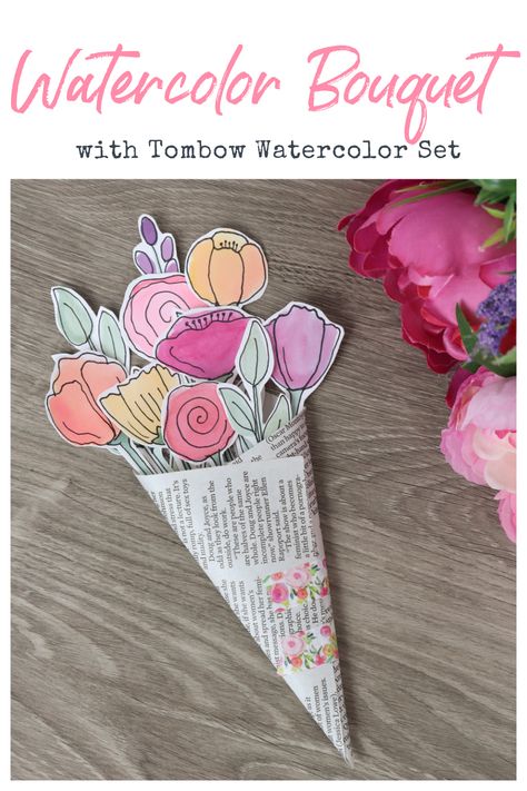 Image contains a watercolor flower bouquet on a wooden table with silk flowers off to the side. Diy Craft Bouquet, White Watercolor Flowers, Watercolor Crafts To Sell, Diy Flower Card, Flower Bouquet With Paper, Watercolor Projects For Kids, Watercolor Activities, Flower Art Projects, Nature Art For Kids