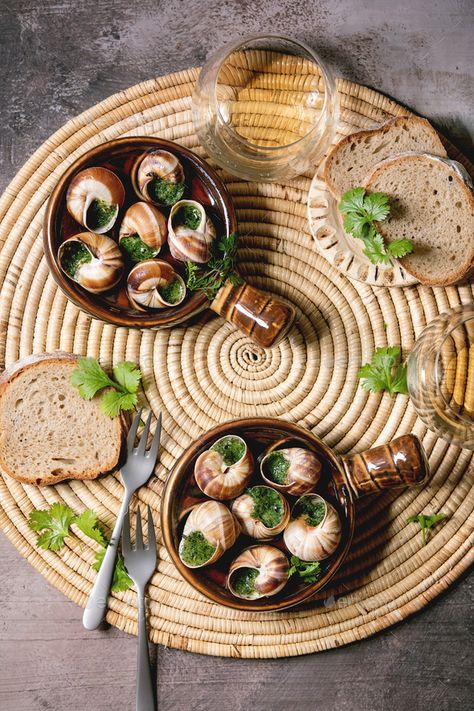 Escargots de Bourgogne by NatashaBreen. Escargots de Bourgogne ¨C Snails with herbs butter, gourmet dish, in traditional ceramic pans with coriander, bread, g... #Sponsored #Snails, #herbs, #butter, #NatashaBreen Canned Escargot Recipe, Escargot With Puff Pastry, Escargot Recipe Appetizers Garlic Butter, Escargot In Mushroom Caps Recipe, Traditional French Food, Snail Food, Snail Dishes, Escargot Recipe, Paris Escargot