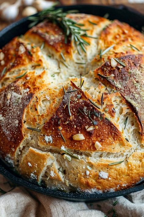 Savor the aroma of this Rustic Garlic Rosemary Skillet Bread, perfectly crusty and infused with fresh herbs. Easy, delicious, and homemade! #BreadBaking #GarlicLovers #RosemaryRecipes #EasyCooking #HomemadeBread Rosemary Skillet Bread, Rustic No Knead Rosemary Garlic Bread, Sourdough Rosemary Garlic Bread, Garlic Rosemary Sourdough Bread, Crusty Bread Recipe Dutch Oven, Herb Sourdough Bread, Rosemary Bread Machine Recipe, Rosemary Garlic Bread Recipe, Cast Iron Bread Recipes