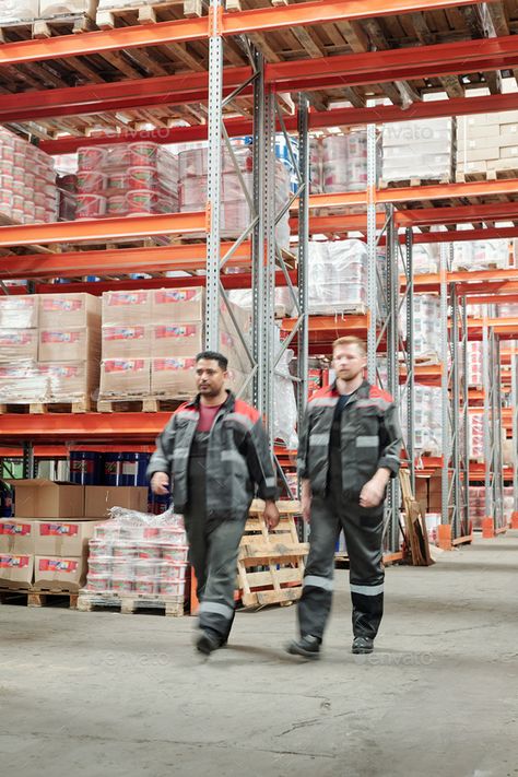 Two young intercultural male workers in uniform moving along large factory by Pressmaster. Two young intercultural male workers in uniform moving along large factory or warehouse with huge shelves with packed... #Sponsored #workers, #uniform, #moving, #young Work From Home Canada, 2000s Fashion Men, Factory Photography, Apply Job, Teamwork Skills, Working Men, Factory Worker, Modern Factory, Men's Uniforms