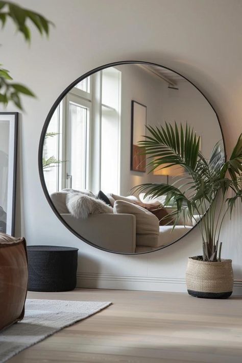 How To Hang Round Mirror: Stylish Display Techniques Huge Round Mirror, Alcove Mirror Ideas, Circle Mirror Above Sofa, Big Round Mirror Entryway, How To Style A Round Mirror On Wall, Round Mirror In Living Room Ideas, Large Round Mirror Decor Ideas, Mirror And Chair In Bedroom, Round Mirror In Bedroom