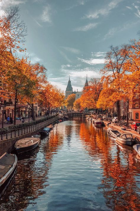 Amsterdam's pretty tree-lined canals get an autumnal makeover in the Netherlands. For more beautiful autumn photos from around the world visit: cntraveller.com/gallery/photos-of-autumn Landscapes Beautiful, Autumn Landscapes, Landscapes Photography, Peisaj Urban, Pretty Trees, Orange Leaves, Autumn Foliage, Pretty Landscapes, Amsterdam Travel