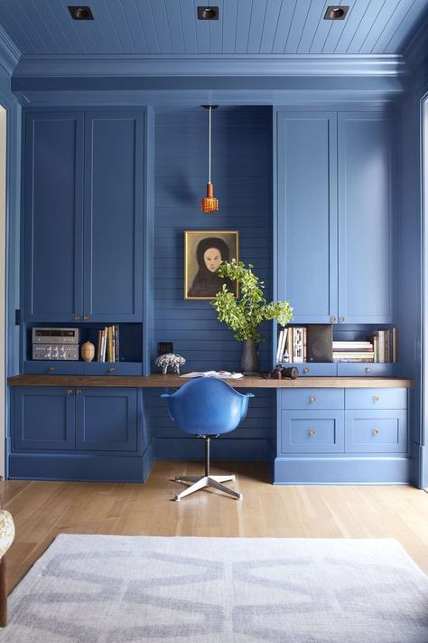 Striking blue built-ins with plenty of storage in the home office. Color Perspective, Hide Clutter, Blue Home Offices, Security Design, Hide Cords, Modern Home Offices, Interior Design Minimalist, Peaceful Mind, Blue Office