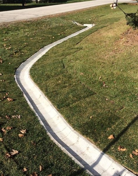 Ditch block prevents weeds and other obstructions that will block the water flow. Project installed by Dresen Landscape Contractors in Racine, WI. Ditch Ideas, Pretty Landscaping, Yard Drain, French Drain Installation, Landscape Drainage, Backyard Drainage, Drainage Ditch, Yard Drainage, French Drain