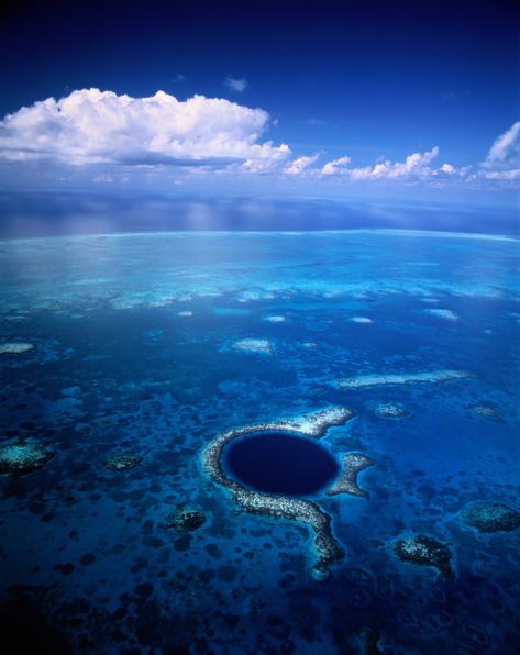 The Great Blue Hole in Belize Is One of the World's Most Gorgeous Mysteries | The Great Blue Hole, about 43 miles off the mainland of Belize, is a giant sinkhole near the center of Lighthouse Reef. The Great Blue Hole, Blue Hole Belize, Great Blue Hole, Placencia Belize, Belize Barrier Reef, Belize Beach, 2022 Goals, Belize Vacations, Italy Destinations