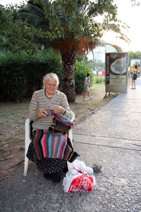 Knitting in budva. | this little old woman was just knitting… | Flickr Woman Crocheting Photography, Person Knitting, Open Air Market, Grandma Knitting, Knitting Pictures, Women Knitting, Sculpture Projects, Embroidered Quilts, Cracker Barrel