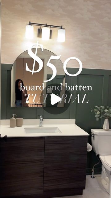 Hana | DIY & Home Design on Instagram: "💰 $50 board and batten made for this economy (SAVE THIS)  My best tip to save money- grab a 10 pack of 1x4 baseboards! They look the exact same and will save you HUNDREDS of dollars. Plus they are primed!  Plan around the antlers and vanity to make the cuts easy! If you’re worried about the spacing, mine are 1-2” different on each wall, and you can’t tell.   Use a pin nailer or glue. If you’re using a pin nailer, use the shortest nail possible. The caulk will act as a glue between the board and wall.   Any other questions? Drop them in 👇🏼  Board and batten, bathroom board and batten, diy tutorial, accent wall" Bathroom Wall Makeover Diy, Board And Batten Bathroom With Window, Navy Board And Batten Wall Bathroom, Bathroom Green Board And Batten, Bat And Board Walls Bathroom, 1x4 Baseboards, Bead And Batten Wall Bathroom, Board And Batten In Small Bathroom, Board And Barton Bathroom