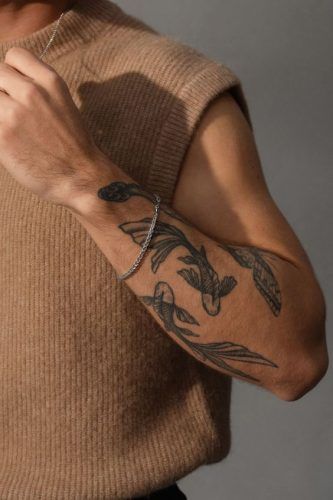 Discover 20 Unique Pisces Tattoo Ideas for Men in 2024 - Embrace Your Zodiac Sign Pisces Tattoo Sleeve, Pisces Tattoo Men, Pisces Arm Tattoo, Fish Tattoo For Men, Pisces Tattoo Ideas, Idea For Tattoo, Pisces Constellation Tattoo, Pisces Tattoo, Sleeve Tattoos For Guys