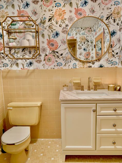 Used wallpaper from Roommates Decor to accent original vintage yellow tile to give it a fresh new look! Accessorized with gold accents throughout the bathroom too! In love!! Yellow Bathroom Suite, Vintage Bathroom Ideas 1950s Modern, Light Yellow Bathroom Tiles, Yellow Tile Bathroom Ideas Vintage, Yellow Tile Bathroom Wallpaper, Bathrooms With Yellow Tile, Yellow Tile In Bathroom, Yellow Wallpaper Bathroom Ideas, Bathroom Yellow Walls