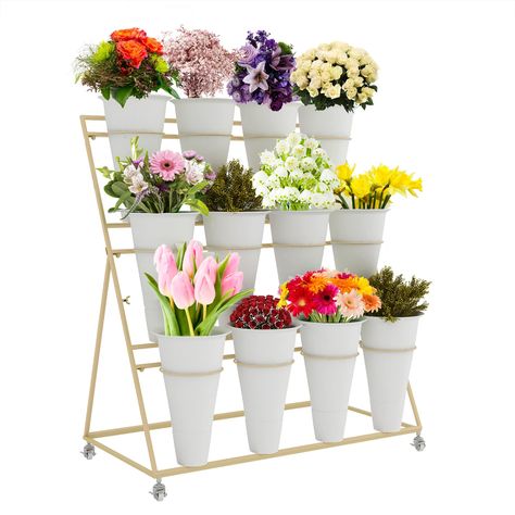 PRICES MAY VARY. iron 【5-Star Display Rack】: In order to avoid product damage during shipping, our flower display stand is shipped by two packages, one flower stand and one bucket. The planter organizer adopts a three-layer ladder structure, Freestanding open design, No Shelter From Each Other, Easy to fertilize and water, Helps plants get enough sunlight in a comfortable environment to encourage growth. 【Durable & Sturdy】: The Steel Frame Design Makes The Metal cart plant stand Possesses Charac Flower Display Stand, Moving Plants, Plant Stand With Wheels, Flower Cart, Metal Plant Stand, Plastic Buckets, Flower Bar, Flower Bucket, Outdoor Flowers