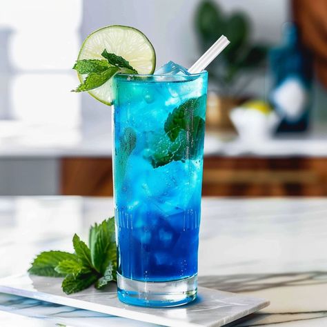 Blue Curacao Mojito, Drink Essentials, Blue Mojito, Fruit Mojito, Burger Images, Mojito Drink, Classic Mojito, Blueberry Mojito, Mojito Mocktail