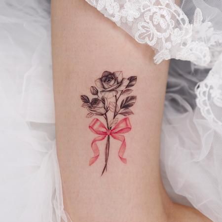 Flower with Ribbon on Thigh by Yojo Grim (Joohyun Jo): TattooNOW Flower With Ribbon, Ribbon Tattoos, Bow Tattoo, Floral Tattoo Sleeve, Feminine Tattoos, Like Instagram, Flower Tattoos, Maple Leaf Tattoo, Sleeve Tattoos