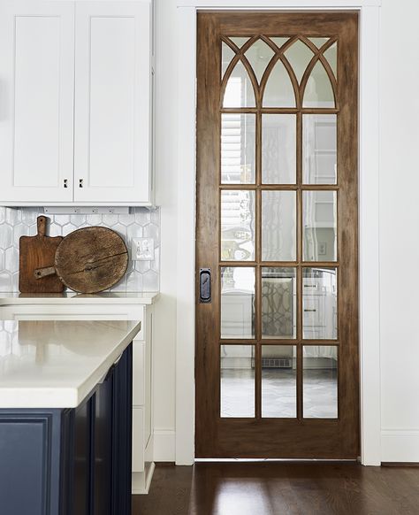 Antique pocket door with beautiful wood stain.  Interior design by @rebeccadriggsinteriors Wood Pocket Doors Interior, Stained Pocket Doors, Antique Pocket Door, Rustic Pocket Door, Unique Pocket Doors, Vintage Pocket Door, Antique Pocket Doors, Wooden Pocket Doors, Pocket Doors With Glass Panels