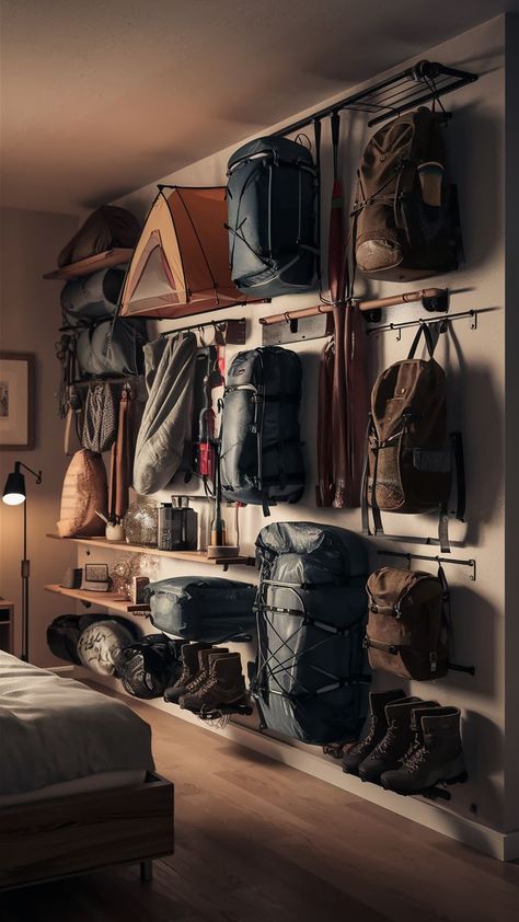 A studio apartment with a camping gear wall, efficiently storing camping gear and outdoor equipment. Gear Wall Storage, Camping Gear Wall, Outdoor Gear Room, Gear Room Organization, Outdoor Gear Organization, Outdoor Gear Storage, Gear Organization, Camping Gear Storage, Garage Storage Inspiration