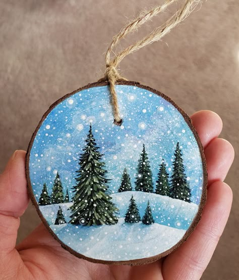 This unique wooden ornament is completely hand-painted (acrylic paint and protective sealer). I turn each wood piece into an original rustic painting, and I then attach twine as a hanger. These are great holiday gifts, stocking stuffers, and keepsakes. Size: Roughly 2.4 inches to 3 inches in diameter. The listed price is for one ornament. I started creating ornaments for fun in 2019, and it quickly turned into a fun side job! I sell my painted ornaments, along with other handmade decor, locally Painted Wooden Stocking, Wood Painting Ornaments, Easy Wood Ornament Painting, Acrylic Painting On Wood Slice, Painted Wood Slice Christmas Ornaments, Wood Painting Christmas, Painted Wood Circle Ornaments, Painted Christmas Tree Ornaments, Wood Slice Painted Ornaments