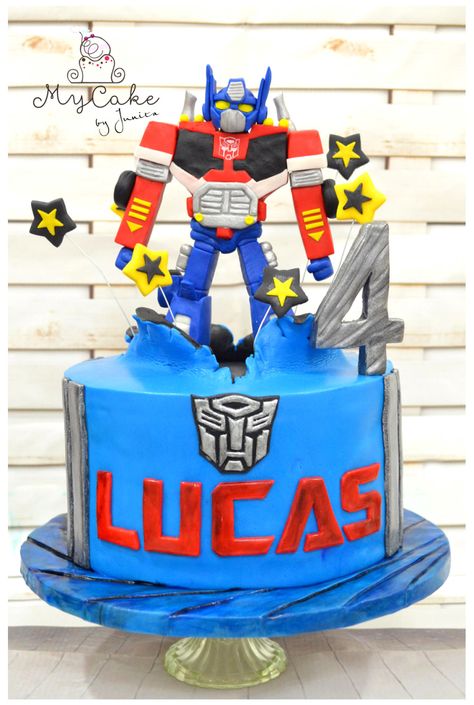 I got an order to make optimus prime, but way less scary for a 4 year old boy :) I could only use red, blue, silver, yellow and a bit of black so here it is, and I’m so happy that his mom and the boy loves it and said looks like his own optimus :)... Optimus Prime Cake Design, Transformer Birthday Party Ideas, Transformer Birthday Party, Prime Cake, Optimus Prime Cake, Rescue Bots Birthday Party, Transformers Birthday Cake, Ironman Cake, Rescue Bots Birthday