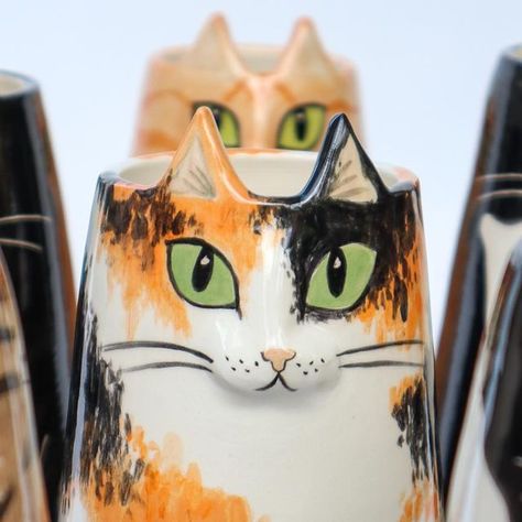 Dóttir Studio on Instagram: "Pre-Orders for Cat Vases // SOLD OUT // I’ve just listed some slots on my website for pre-orders of my cat vases. These are for Christmas delivery, so if you’re the kind of person that likes to get organised in your gift giving then these are for you :) chose from 2 sizes and 8 different colour ways! 🐈‍⬛ . . . . . #catvase #petvase #catsofinstagram #cats #ceramiccat #giftsforcatlovers #vase #illustratedceramics #whimsicalgifts #dottirstudio #budvase #catlover #ceramicanimals #funceramics #cuteceramics #handmadeceramics #wheelthrown #illustration #homedecor" Cat Ceramic Ideas, Ceramic Cat Face, Simple Ceramic Cat, Animal Ceramic Vases, Dog Vase Pottery, Cat Vase, Camp Projects, Cat Vase Ceramics, Get Organised