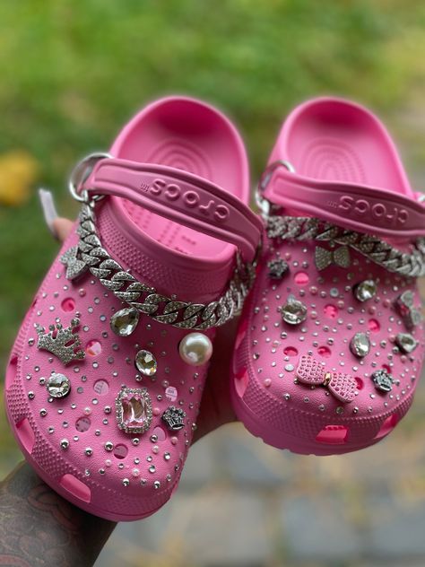 Adult bling crocs include croc color of your choice and Blinged to your want. Pink Sparkle Crocs, Decorated Crocs Shoes Bling, Crochet Crocs Shoes, Crocs Painting Ideas, Pink Crocs With Jibbitz, Pink Crocs Aesthetic, Croc Design Ideas, Crocs Decorations, Croc Slippers