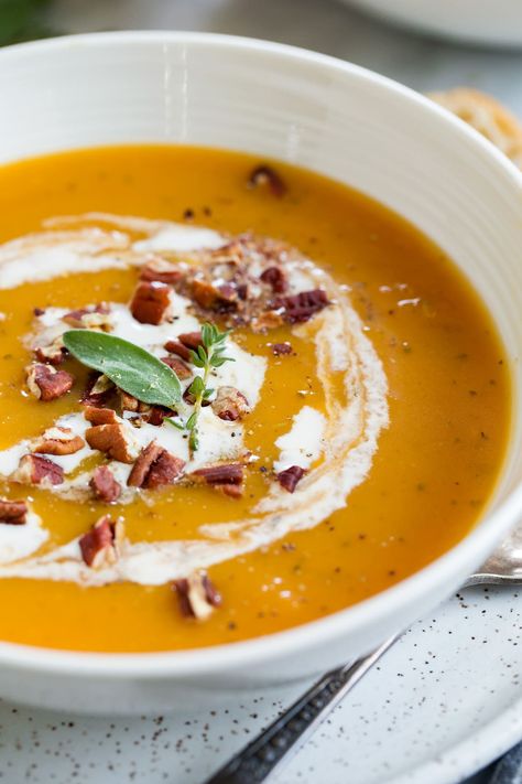 The BEST Butternut Squash Soup - made with roasted squash halves so it's easy and so flavorful! It's an absolutely perfect fall soup! I loved the addition of rich cream and crunch toasted pecans. #butternutsquash #soup #fall #thanksgiving #recipe #cookingclassy Half Baked Harvest Butternut Squash, Butternut Squash Soup Crockpot, Best Butternut Squash Soup, Vegan Butternut Squash Soup, Butternut Squash Soup Recipe, Easy Butternut Squash, Butternut Squash Recipes Soup, Squash Soup Recipe, Roasted Butternut Squash Soup