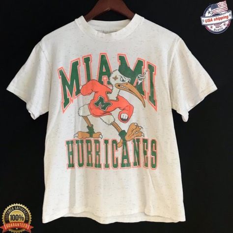 Vintage Ncaa Miami Hurricanes Shirt, University Of Miami Shirt, Unisex T-Shirt Series Shirt, Unisex T-Shirt Sweatshirt, Vintage Shirt Our Classic T-Shirt Serves As The Perfect Short-Sleeved Shirt For Your Unique, Funny, Or Personalized Designs. Brand: Gildan Heavy Weight Fabric Classic Unisex Makes This An Easy Fit Size Up If You Want Something Roomier Our Shirts Materials: 100% Cotton ** Note: - Double Check Your Address Before Ordering. - If You Want To Return The Goods, You Are The One To Pay Miami Shirt, Miami Football, School Shirt Designs, College Tees, Kpop Shirts, University Shirt, Senior Shirts, College Shirts, Shirts Vintage