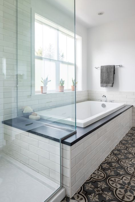 Master bath with both a built-in bathtub and walk-in shower. Shower seat created by extending the bathtub deck. Shadebrick tile surround with encaustic-inspired porcelain for the floor. | Olympic Hills Second Story Addition | Model Remodel, Seattle, WA © Cindy Apple Photography Master Bath Tub Tile Surround, Master Bathtub Tile Surround, Built In Tub Tile Surround, Tub Beside Shower Master Bath, Built In Tub Tile, Sunk In Tub Master Bath, Drop In Tub Next To Shower Ideas, Shower Beside Tub, Bathtub Built In