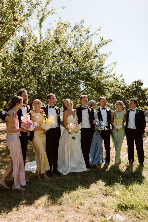 Spring Wedding Tuxes, No Bridal Party Wedding Photos, Summer Colours Wedding, Summer Wedding Colors Groomsmen, Th&th Bridesmaid Dresses, Colorful Bridesmaids And Groomsmen, Wedding Colors Bridesmaids And Groomsmen, Spring Wedding Bridal Party Attire, Pastel Bridesmaid Dresses With Groomsmen