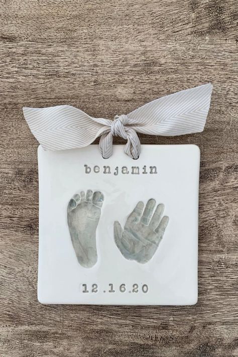 Looking for adorable baby keepsake ideas to cherish forever? Explore our collection of unique and sentimental keepsakes that will capture precious moments with your little one. From personalized handprint ornaments to custom engraved jewelry, these keepsakes make perfect gifts for new parents or a sweet addition to your own nursery decor. Start creating memories that will last a lifetime with these heartwarming baby keepsake ideas. Air Dry Clay Baby Hand Prints, Baby Keepsake Ideas, Baby Crafts To Make, Baby Hand And Foot Prints, Natural Baby Products, Keepsake Ideas, Footprint Keepsake, Handprint Ornaments, Baby Art Projects