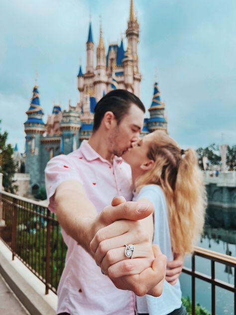 Abby and Dakota share a kiss infront of the Castle at Magic Kingdom in Walt Disney World. They are hugging, and holding hands, outstretching their front arms to show Abby’s new engagement ring. Cinderella Engagement Photos, Engagement Photos Disney, Disney World Engagement Pictures, Disney Couple Pictures, Disneyland Engagement Pictures, Disneyland Couples Pictures, Disney Engagement Pictures, Disneyland Engagement Photos, Disney Photoshoot