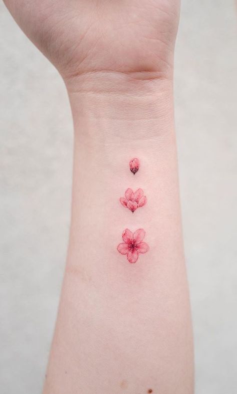 Cute Tattoos Red Ink, Sakura Small Tattoo, Pink Small Tattoos, Pink Color Tattoo, Blossoming Flower Tattoo, Pink Flower Tattoo Small, Pink Blossom Tattoo, Small Pink Tattoo, Hibiscus Tattoo Red